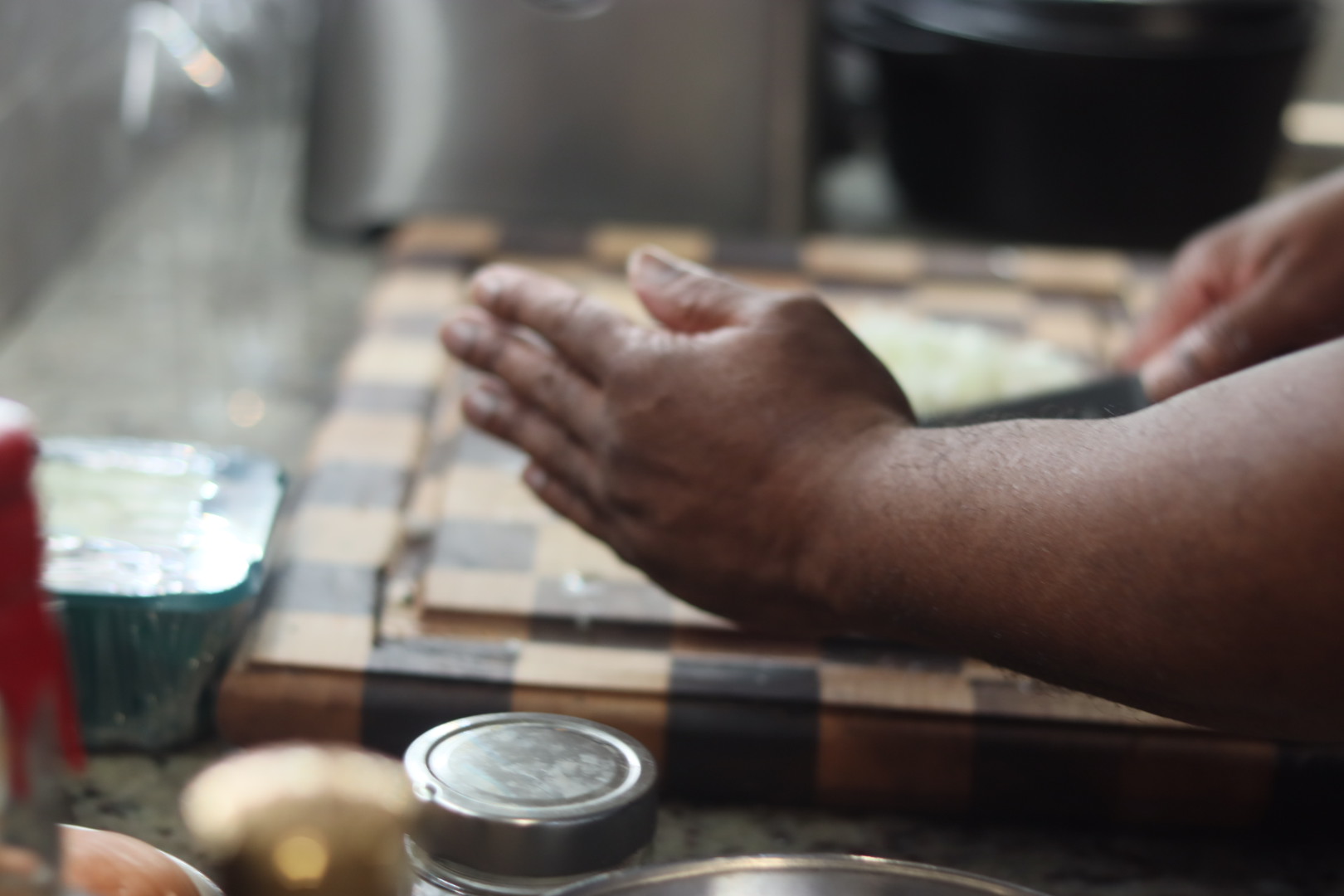 Carl applying finish to a checkerboard cutting board on the bench